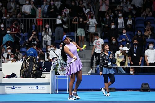 Naomi Osaka hits signed tennis balls into the crowd