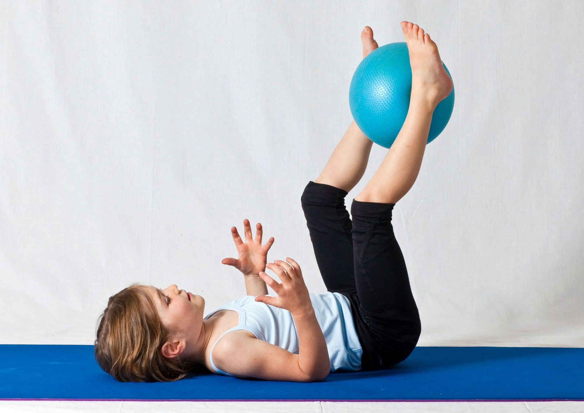 Some yoga ball exercises are specifically meant to increase core strength (Image via Pexels@Lena Helfinger)