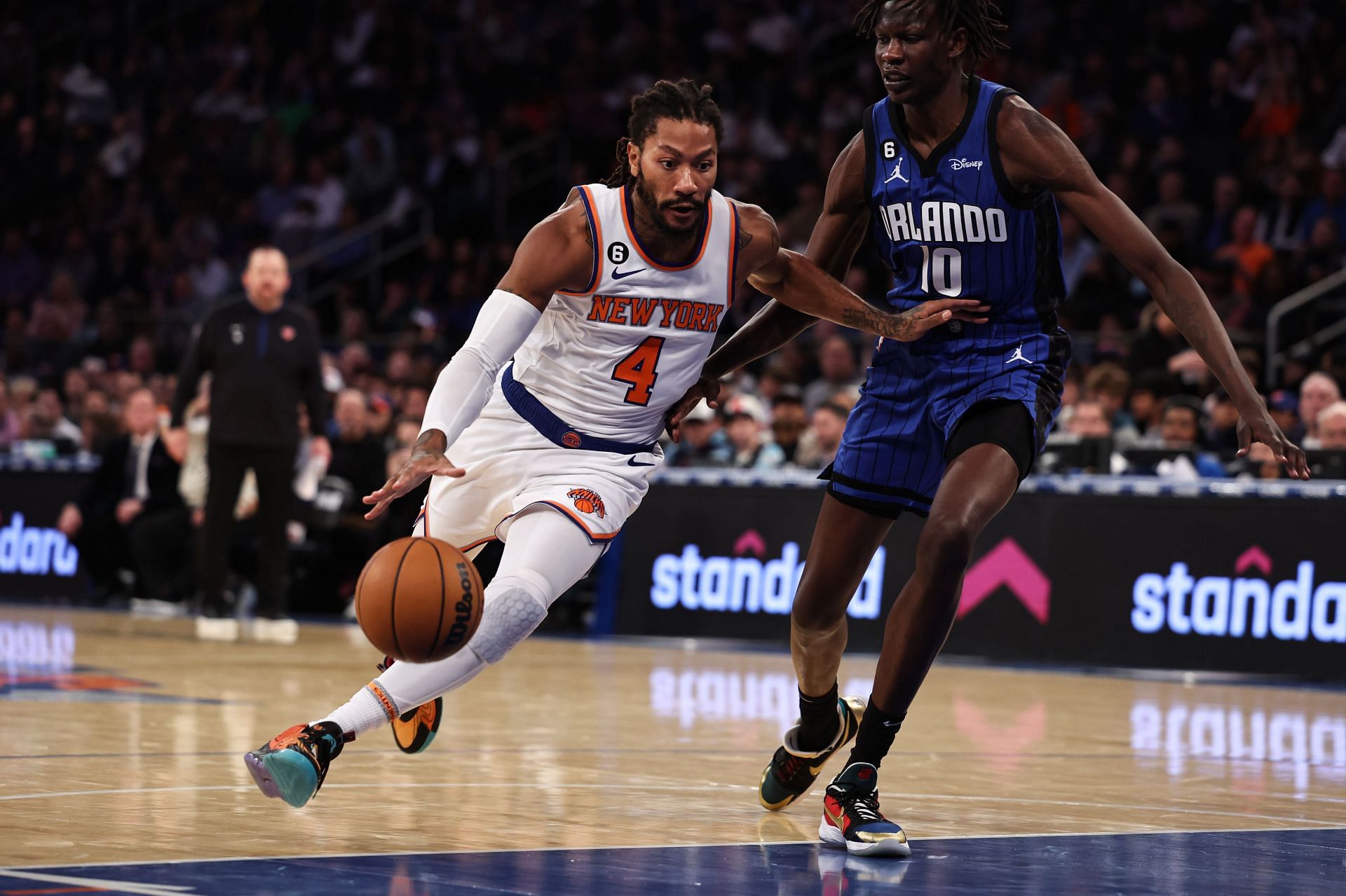 Derrick Rose of the New York Knicks is defended by Bol Bol of the Orlando Magic