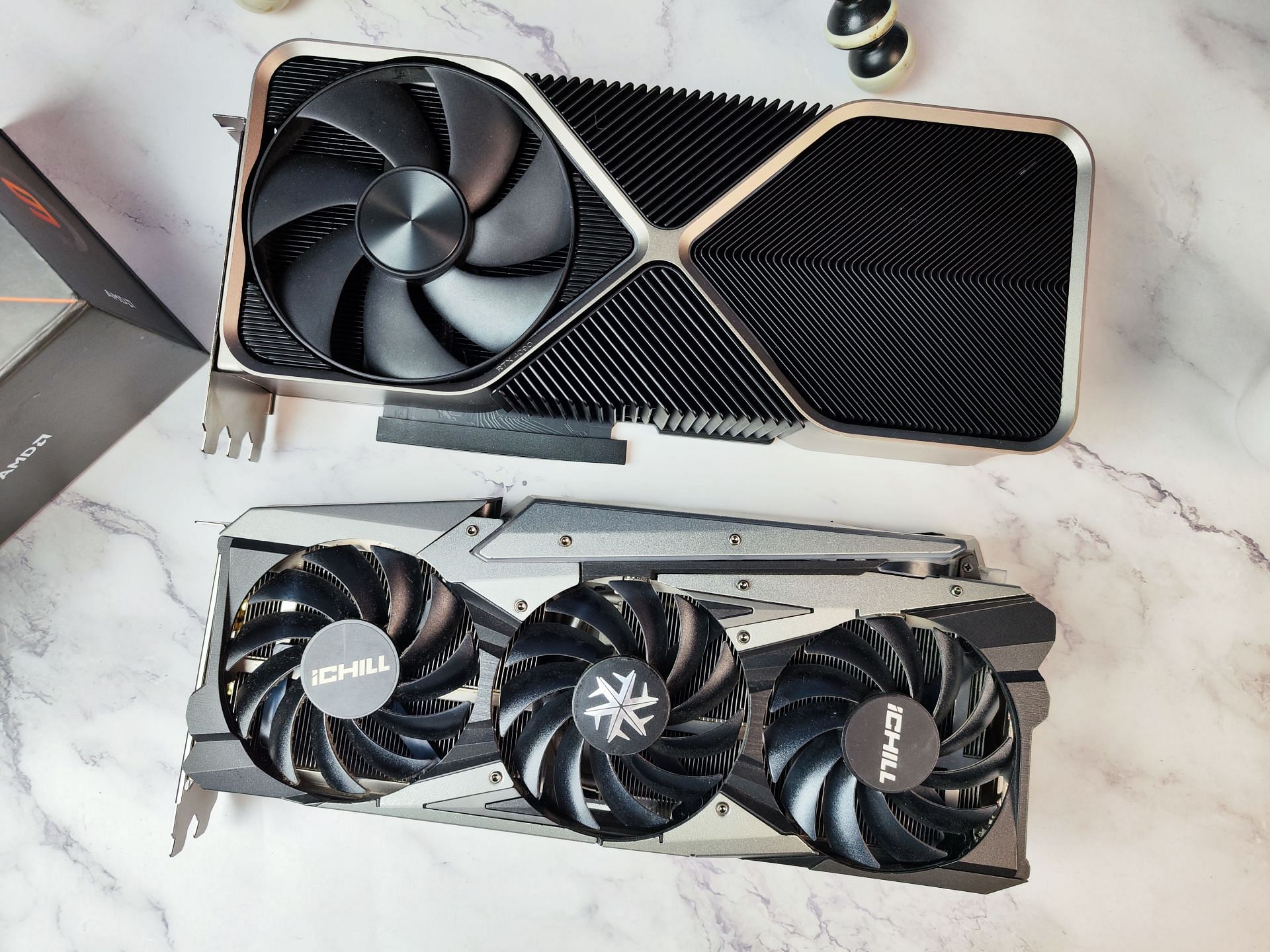 The RTX 3070 iChill X4 and the 4090 side-by-side (Image via Sportskeeda)