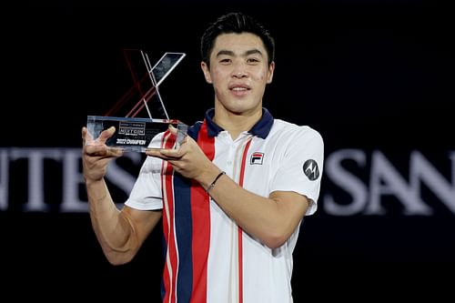 Brandon Nakashima pictured with his Next Gen ATP Finals trophy.