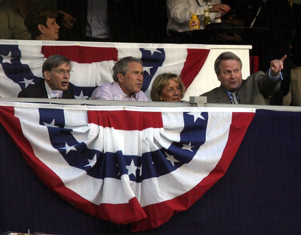 US President George W. Bush (2nd-L) sits with baseball commissioner Bud Selig (L) as the Washington Nationals take on the Arizona Diamondbacks at RFK Stadium April 14, 2005 in Washington, DC.