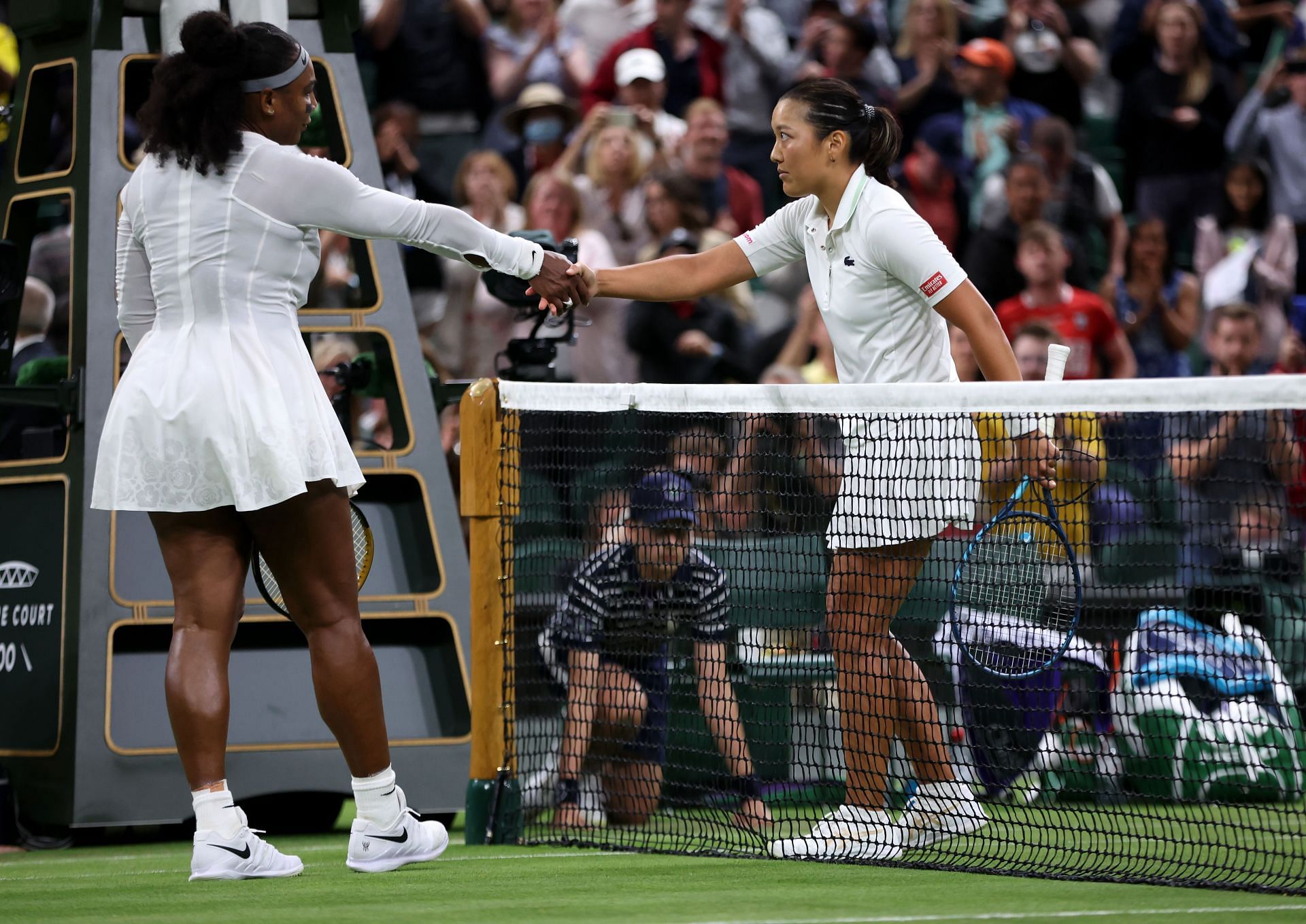 Harmony Tan (R) shakes hands with Serena Williams at Wimbledon 2022