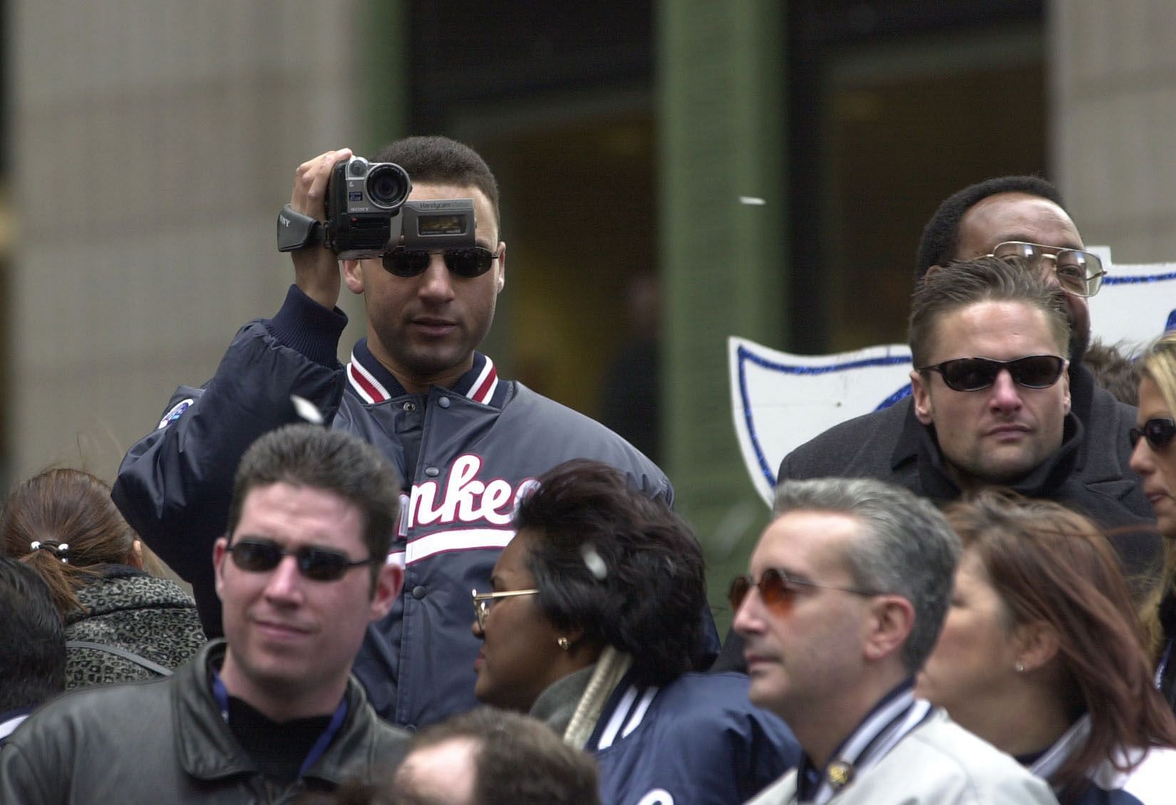 30 Oct 2000: New York Yankee Derek, the World Series MVP, videotapes the crowd during their victory parade up the Canyon of Heroes in New York City. Digital FileMandatory Credit: Ezra Shaw/ALLSPORT