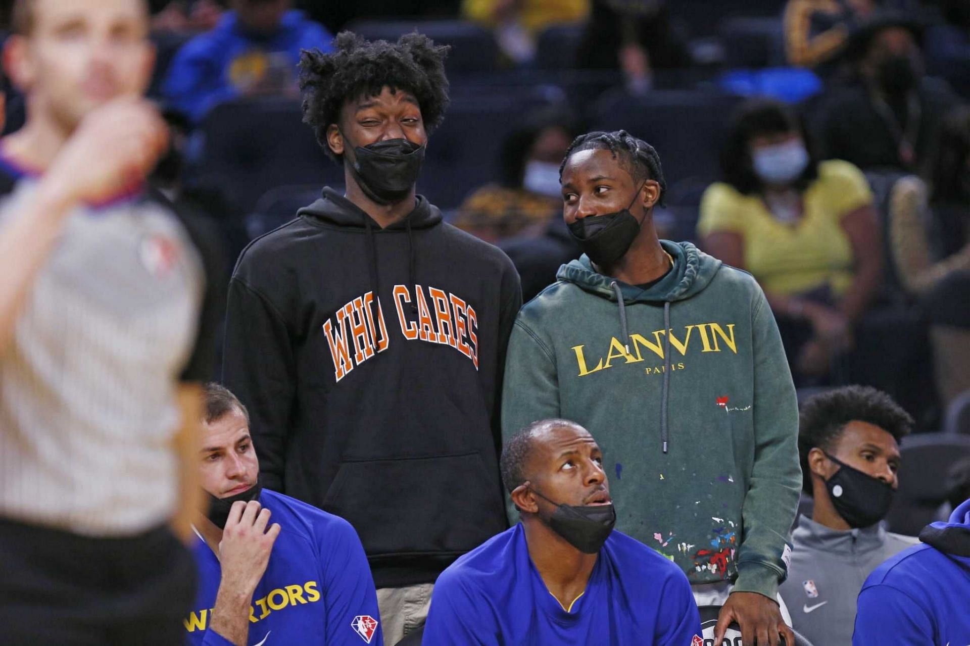 James Wiseman (left) and Jonathan Kuminga on the Golden State Warriors bench [Source: SF Chronicle]