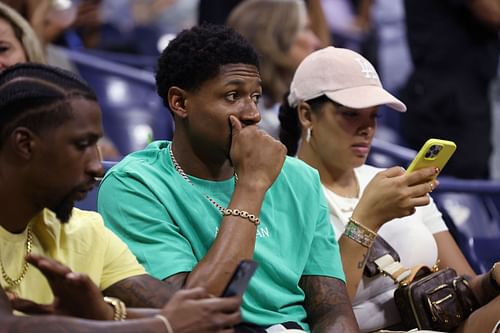 Kentavious Caldwell-Pope and Bradley Beal watching Frances Tiafoe in action at 2022 US Open - Day 12.