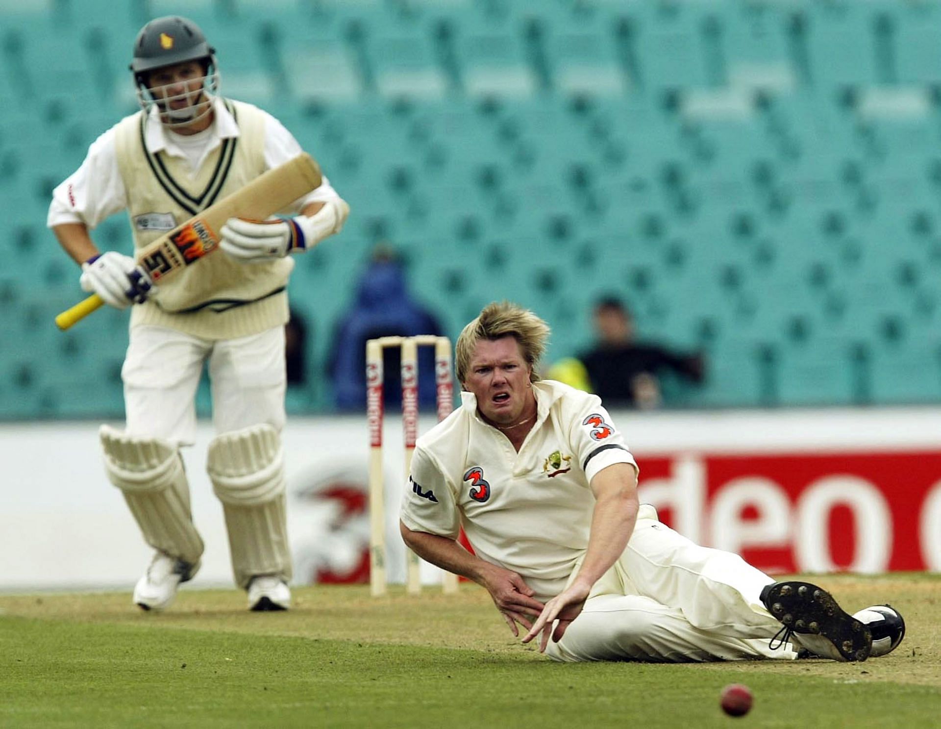 Brad Williams of Australia dives after a drive from Mark Vermeulen of Zimbabwe