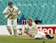 Brad Williams of Australia dives after a drive from Mark Vermeulen of Zimbabwe