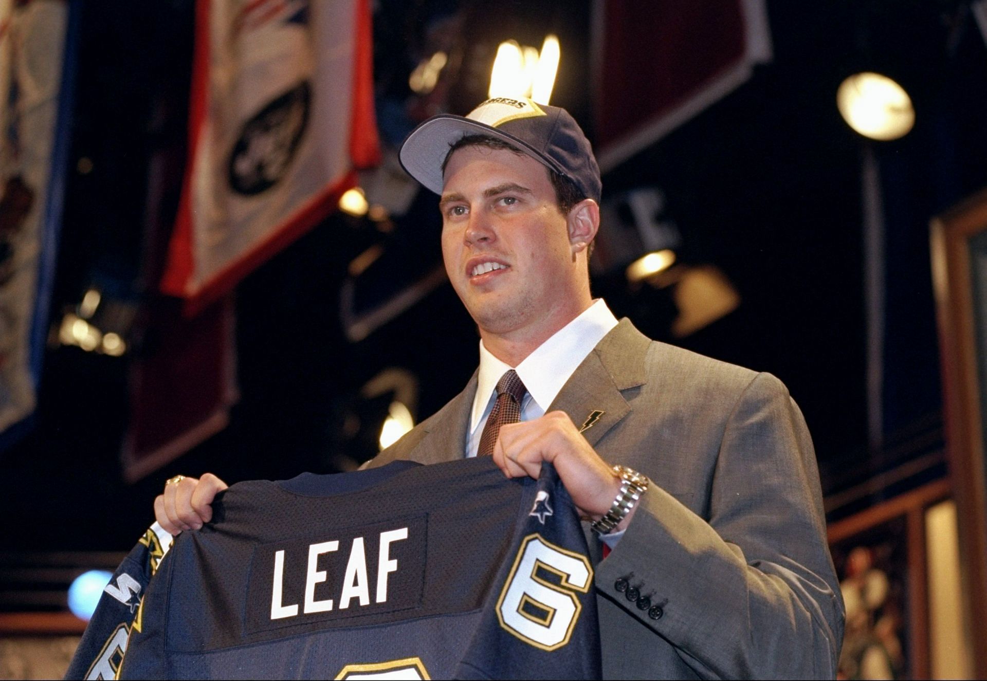 Second-overall pick Ryan Leaf shows off his jersey after being selected by the San Diego Chargers