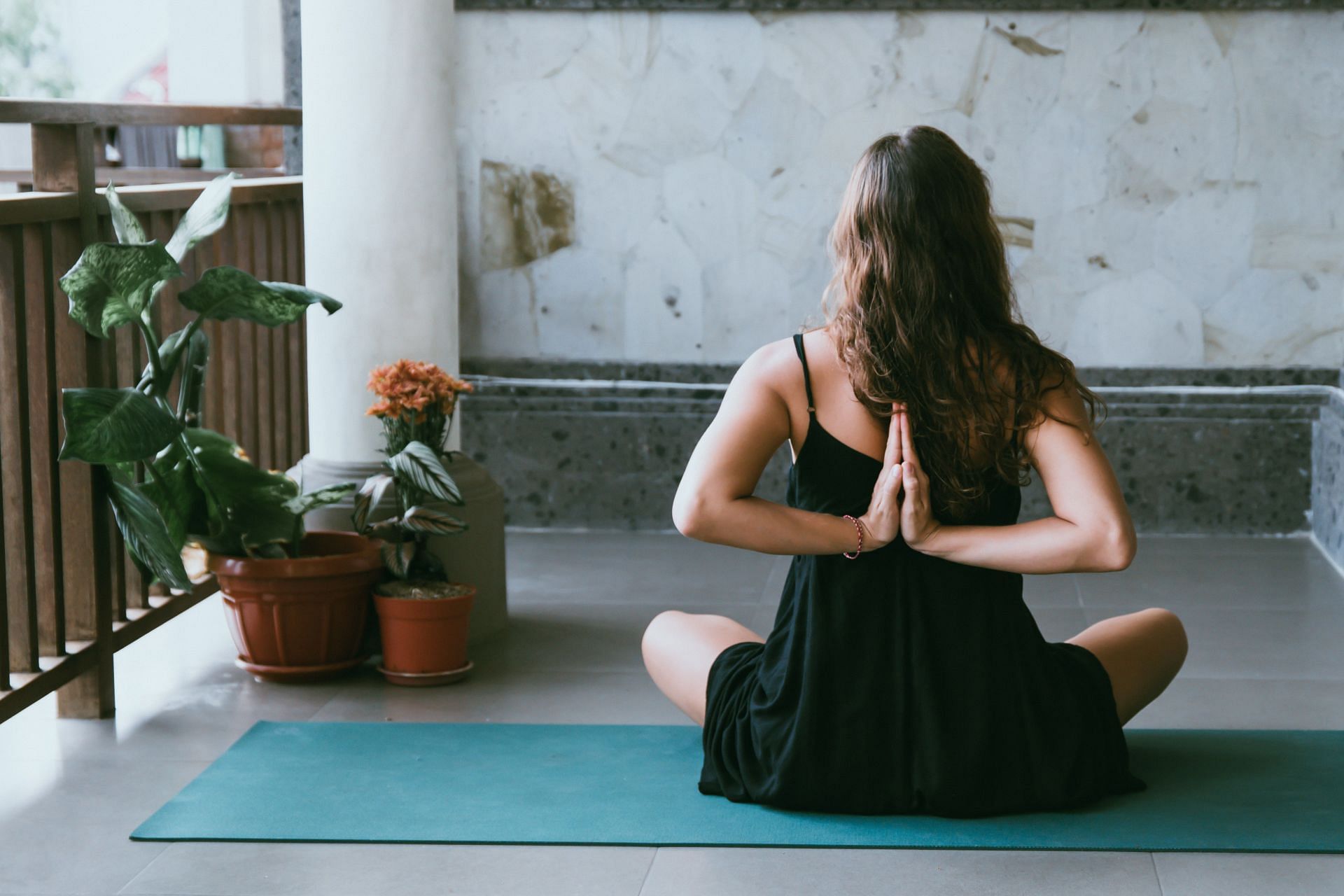 Yoga pose. (Image via Unsplash/Avrielle Suleiman)