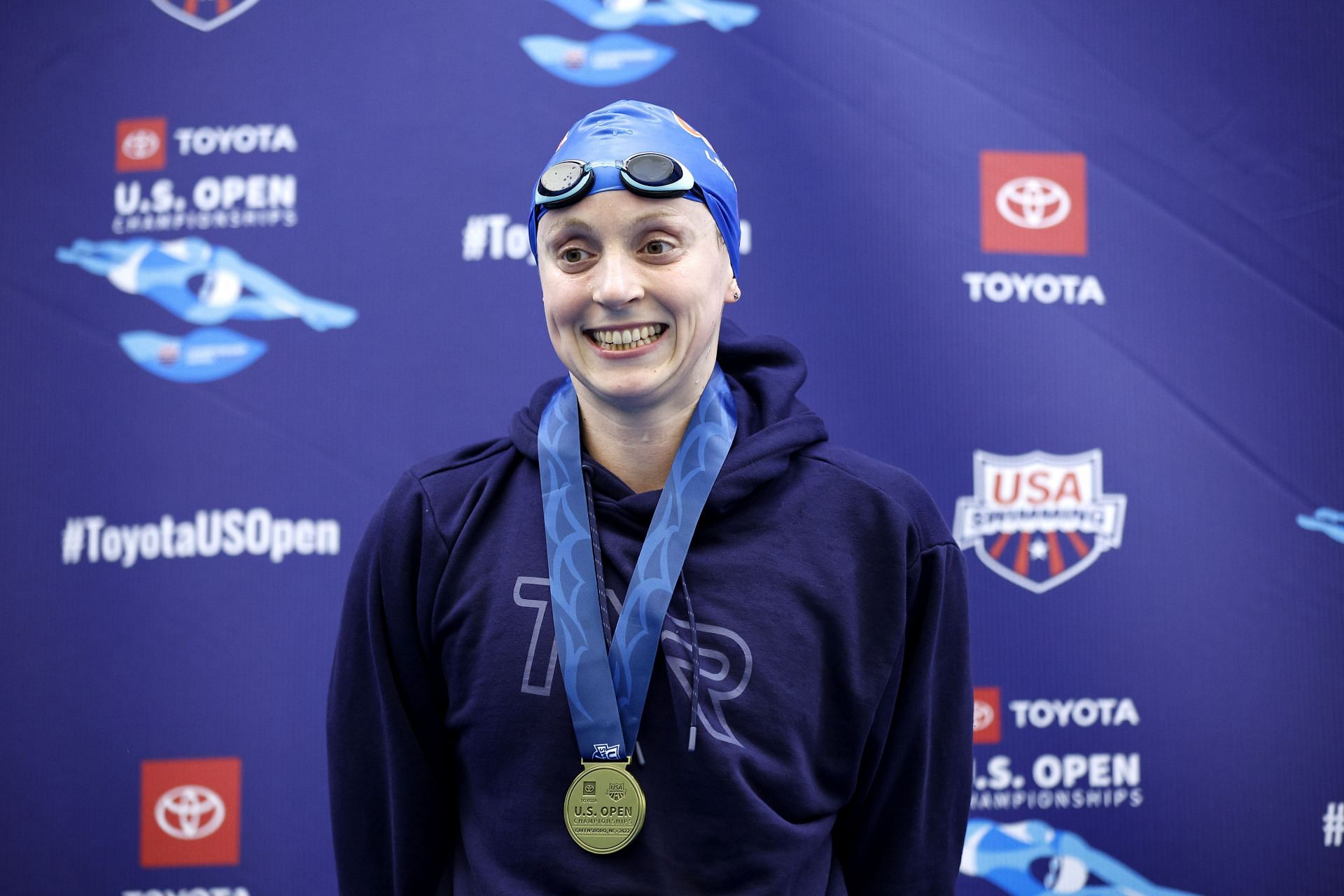 Katie Ledecky poses with her medal after winning the Women&#039;s 1500M Freestyle Final during the Toyota US Open Swimming Championships