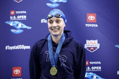 Katie Ledecky poses with her medal after winning the Women's 1500M Freestyle Final during the Toyota US Open Swimming Championships