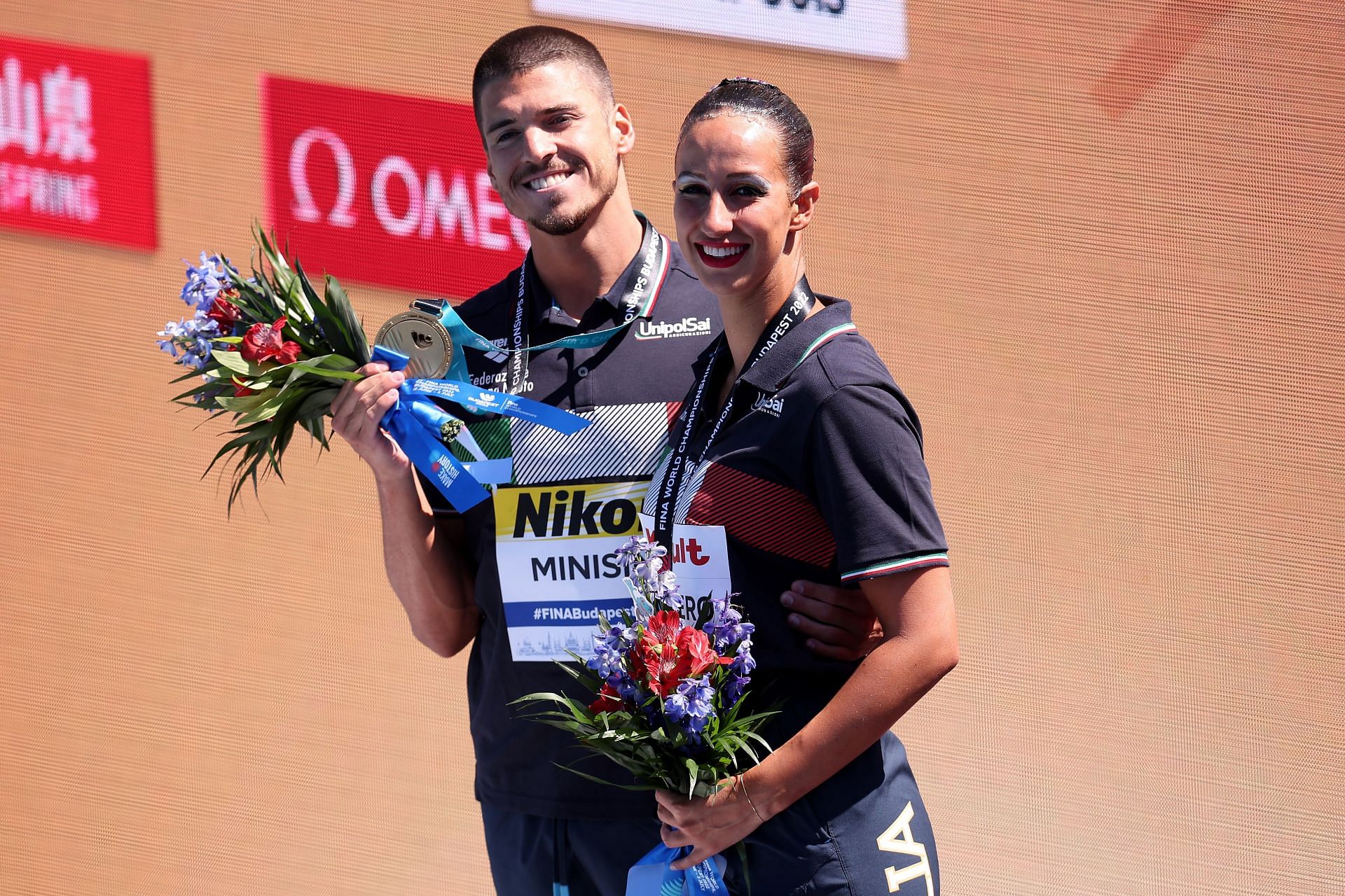 Giorgio Minisini and Lucrezia Ruggiero of Team Italy pose during the medal ceremony for the Mixed Duet Free Final during the 2022 FINA World Championships in Budapest