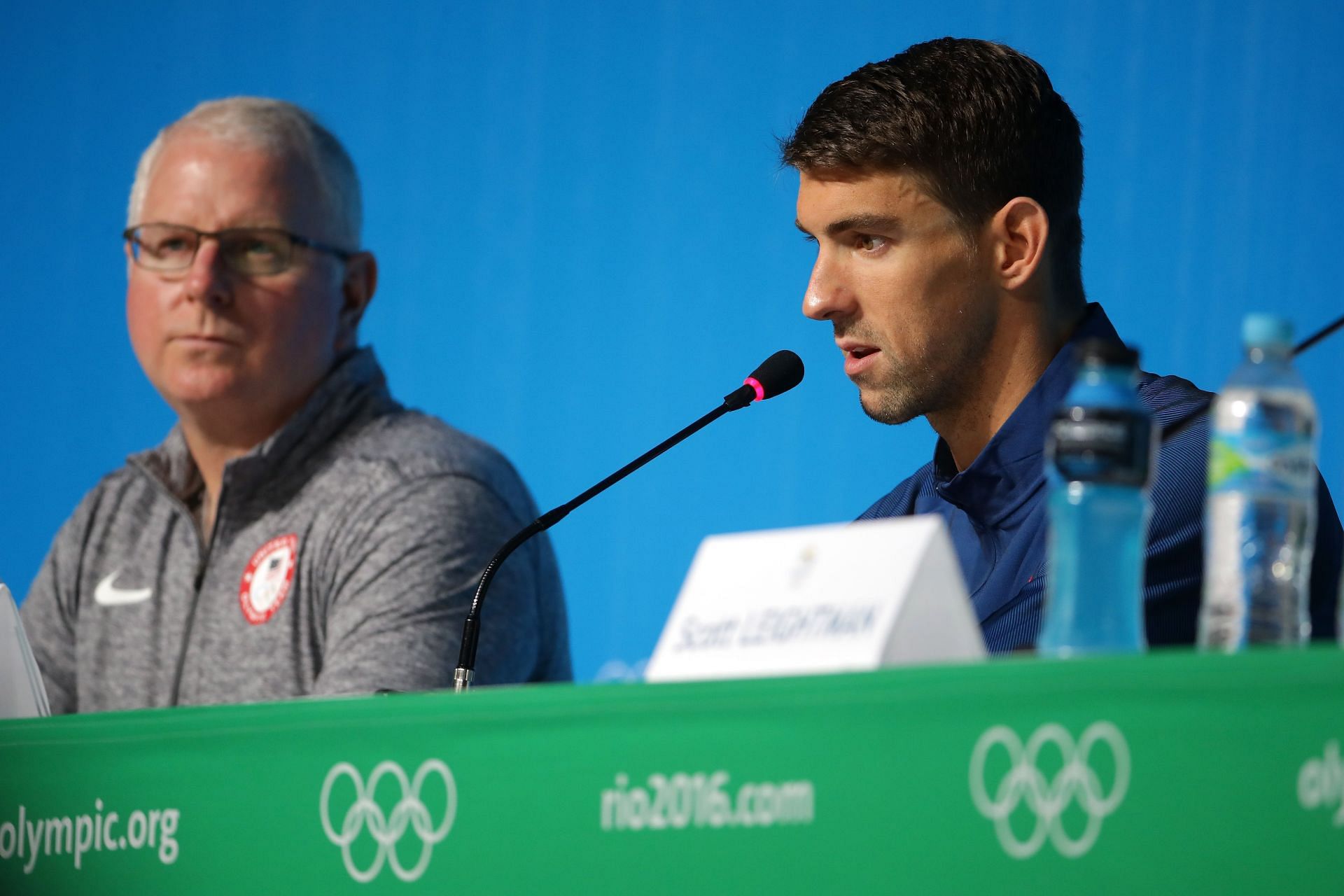 Bob Bowman and Michael Phelps of the United States speak with the media