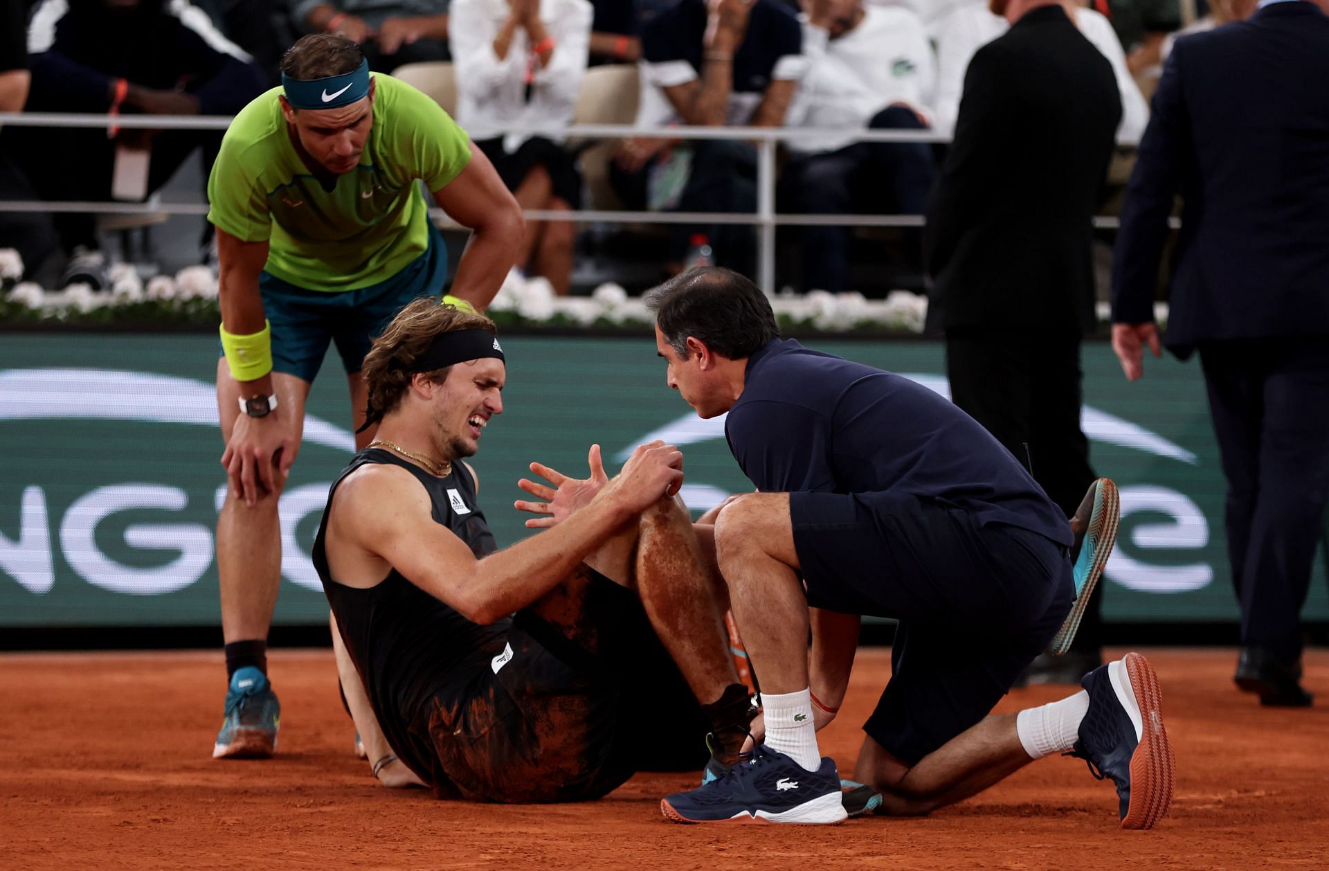 Rafael Nadal lending a helping hand towards Zverev during the 2022 French Open - Day Thirteen