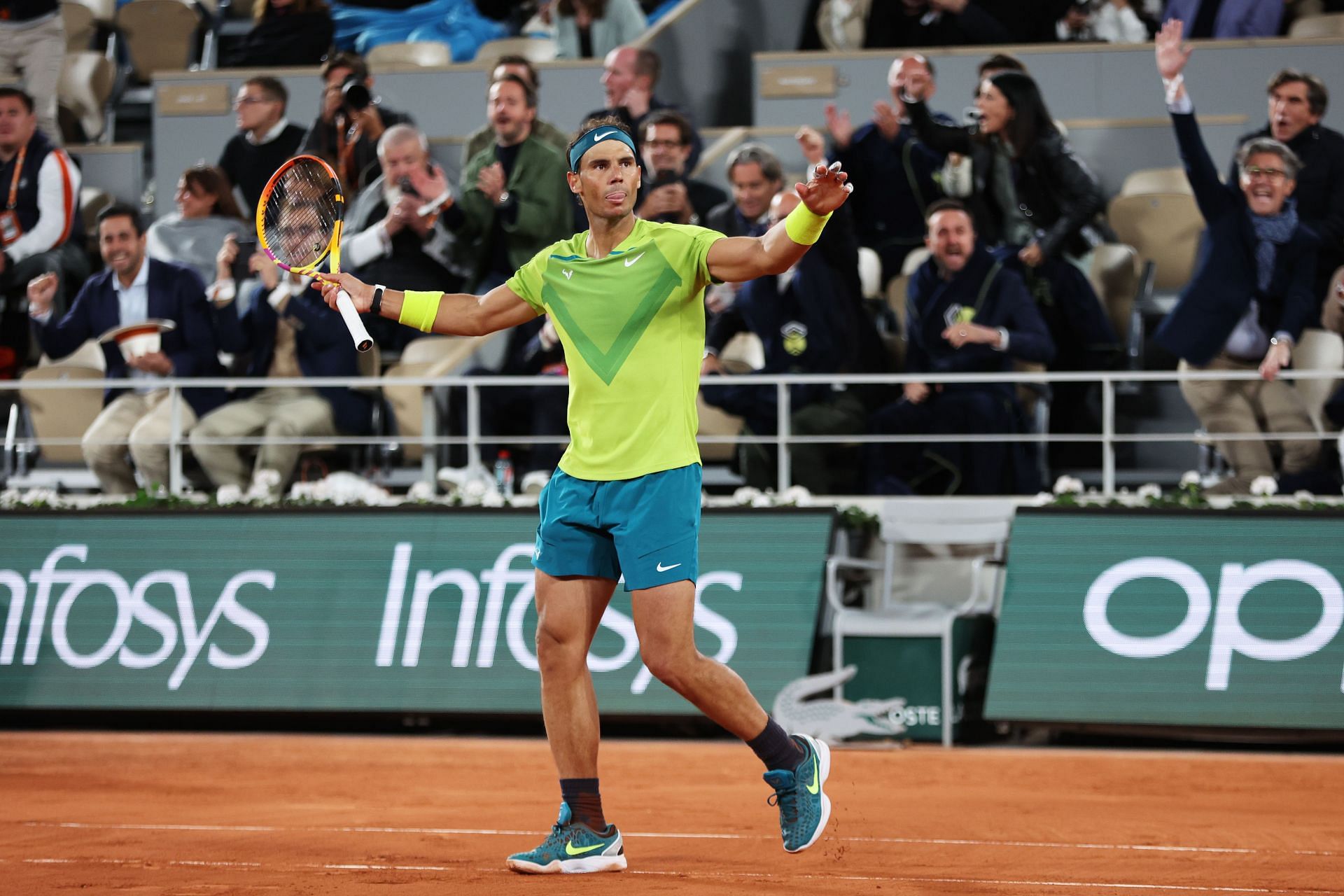 Rafael Nadal celebrates after winning the match point against the defending champion at the 2022 French Open