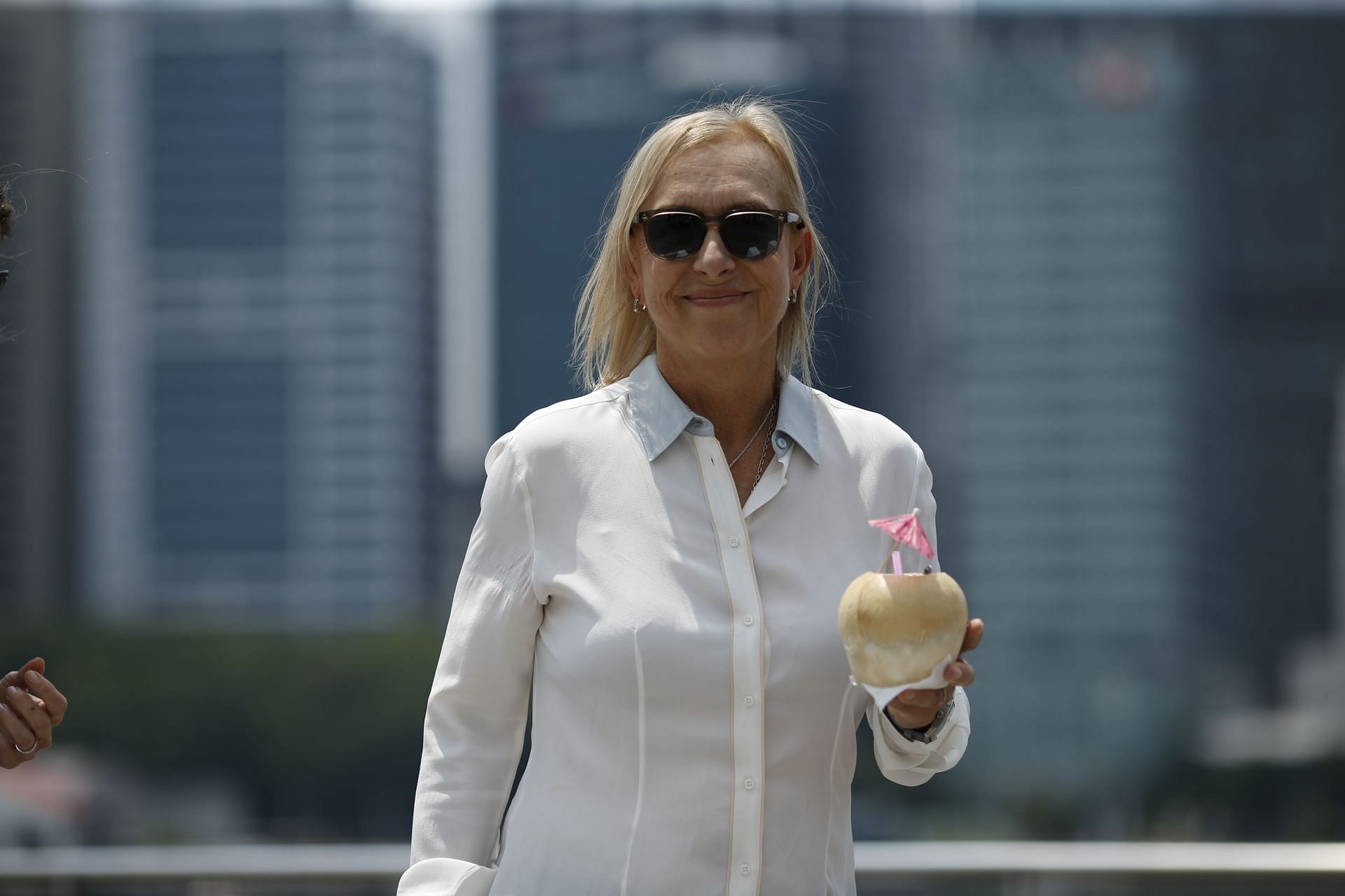 WTA Legend Martina Navratilova enjoys fresh Coconut juice and poses for a photo