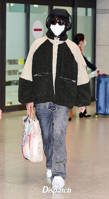 BTS's V (Kim Taehyung) turns heads at the airport with his oversized bag  upon returning to South Korea