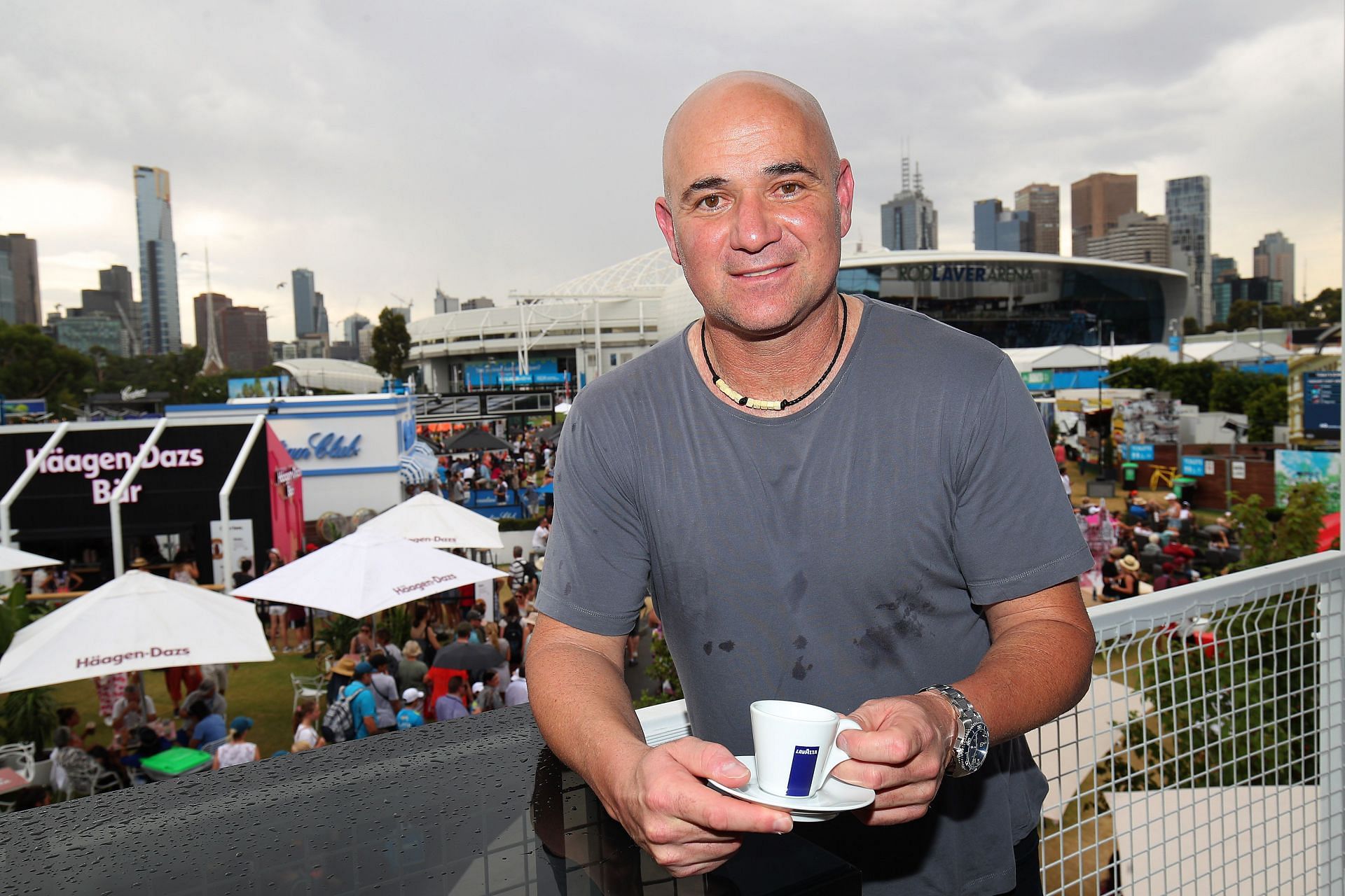 Andre Agassi poses at the Lavazza Cafe at Grand Slam Oval