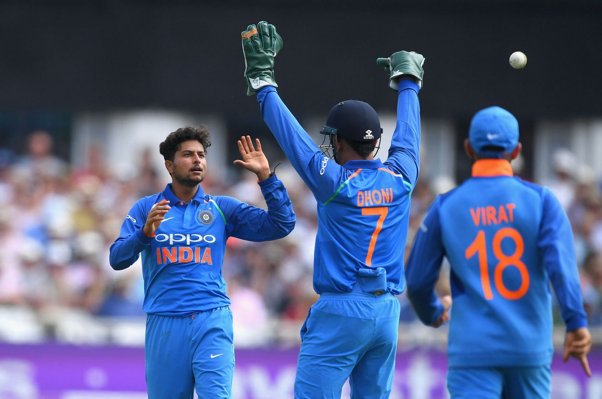 Kuldeep Yadav (L) celebrates a wicket with the former Indian keeper. Pic: Getty Images