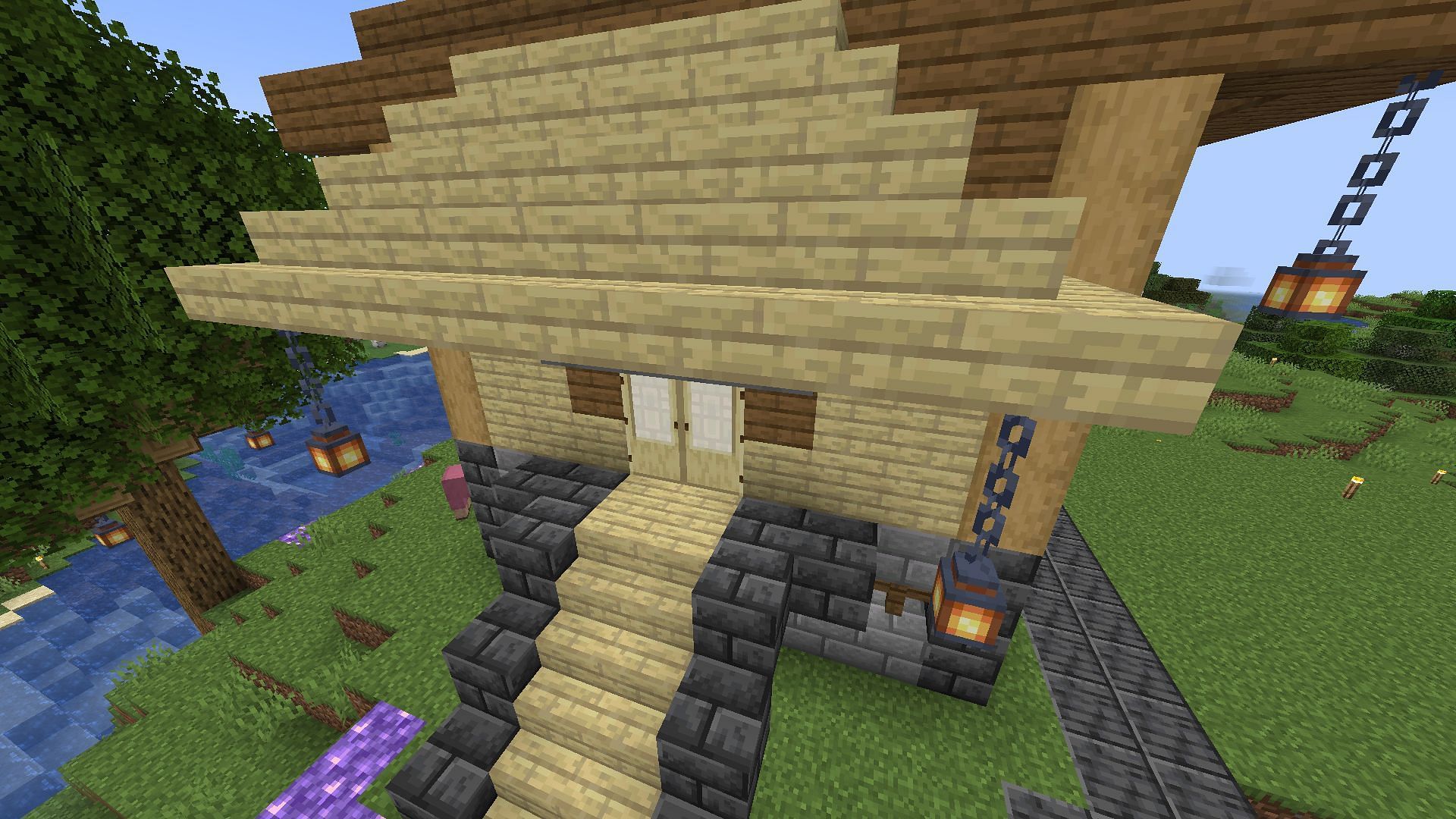 Stairs being used as a shade outside a small hut&#039;s door in Minecraft 1.19 (Image via Mojang)