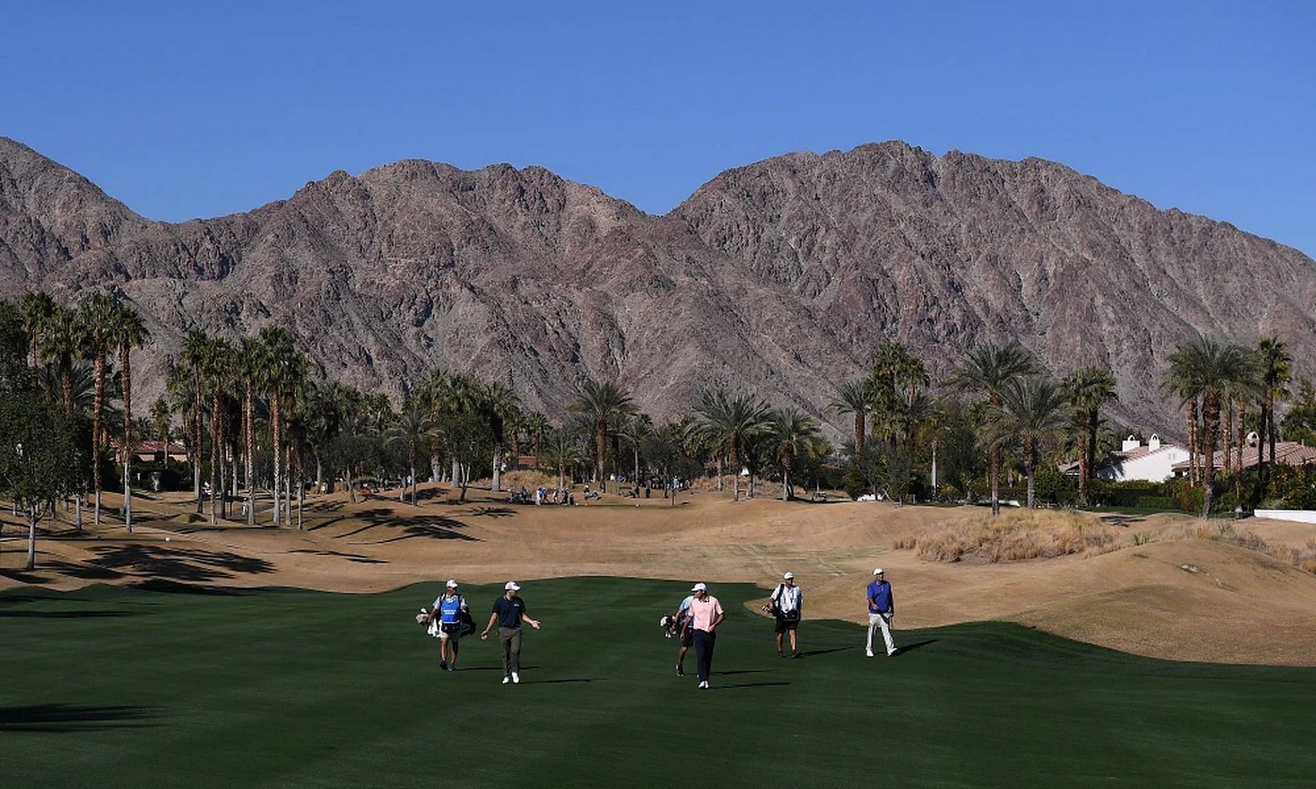 Scottie Scheffler and Patrick Cantlay walk the 11th fairway during the second round of the 2022 American Express 