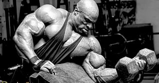 "Is this optimal? Who cares" - Fans react to Ronnie Coleman pulling weights at gym in full sweatsuit