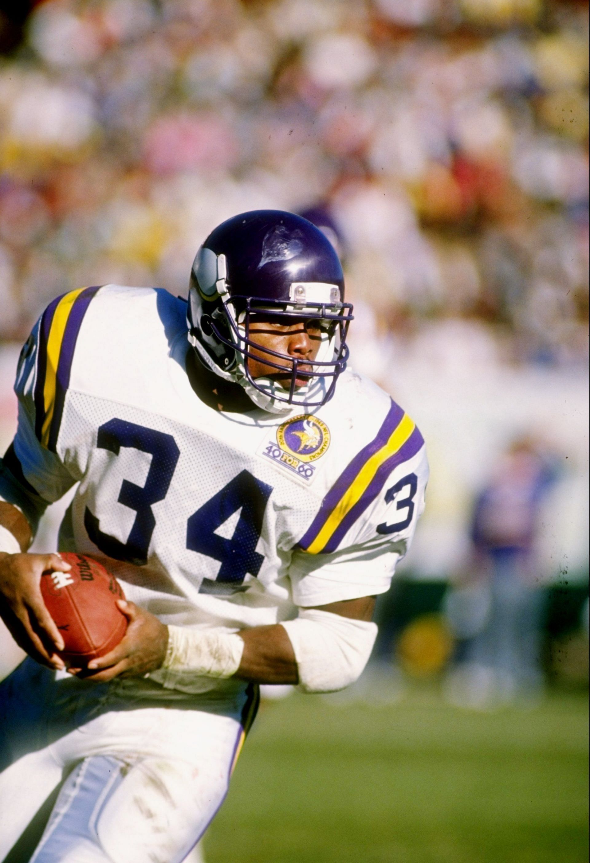 Running back Herschel Walker of the Minnesota Vikings runs with the ball during a game