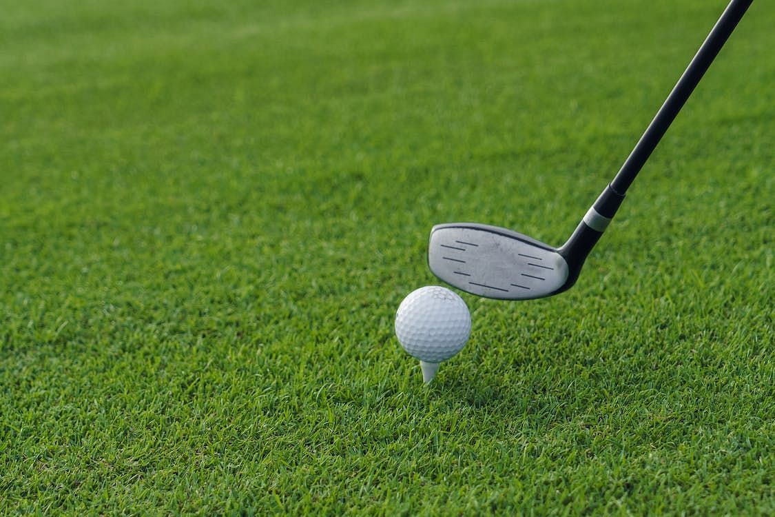 A golfer was charged with assault after attacking man with a club