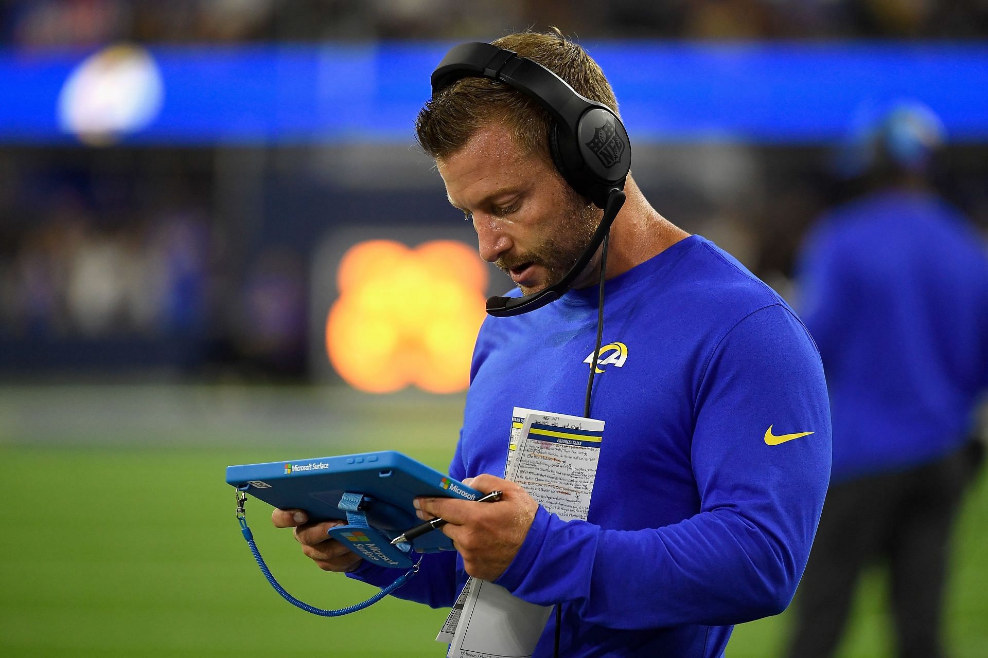 Head coach Sean McVay of the Los Angeles Rams looks at a Microsoft Surface tablet during a game