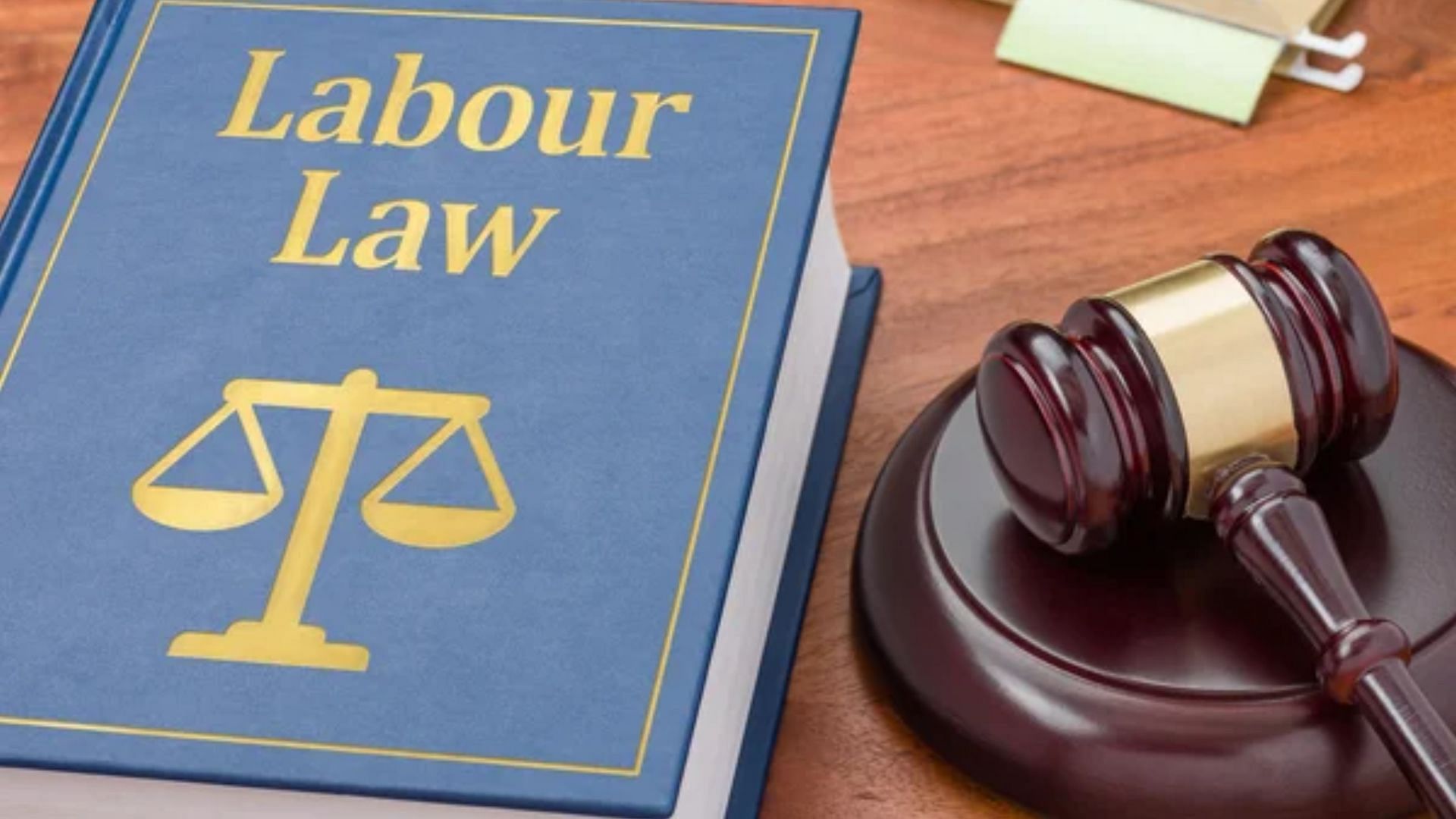 A Labor law book with a gavel (Image via Zerbor/DepositPhotos)