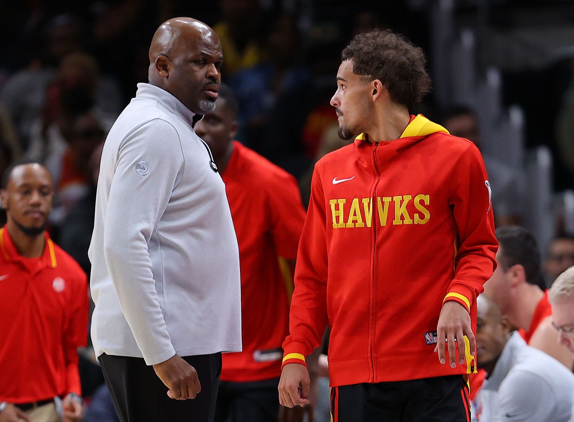 Nate McMillan and Trae Young of the Atlanta Hawks