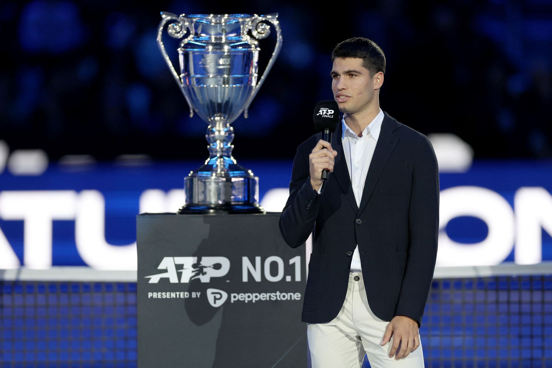 Carlos Alcaraz with the year-end ATP World No. 1 trophy