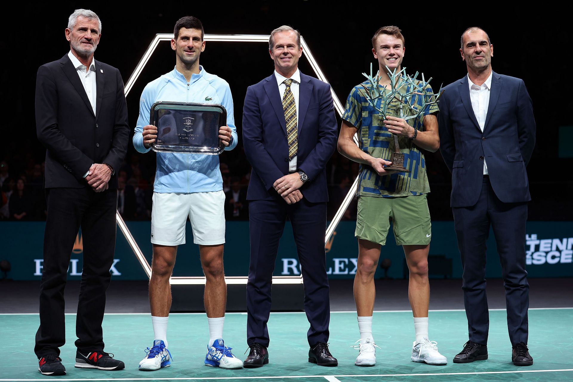 Holger Rune (2nd from R) with the trophy after winning the Paris Masters