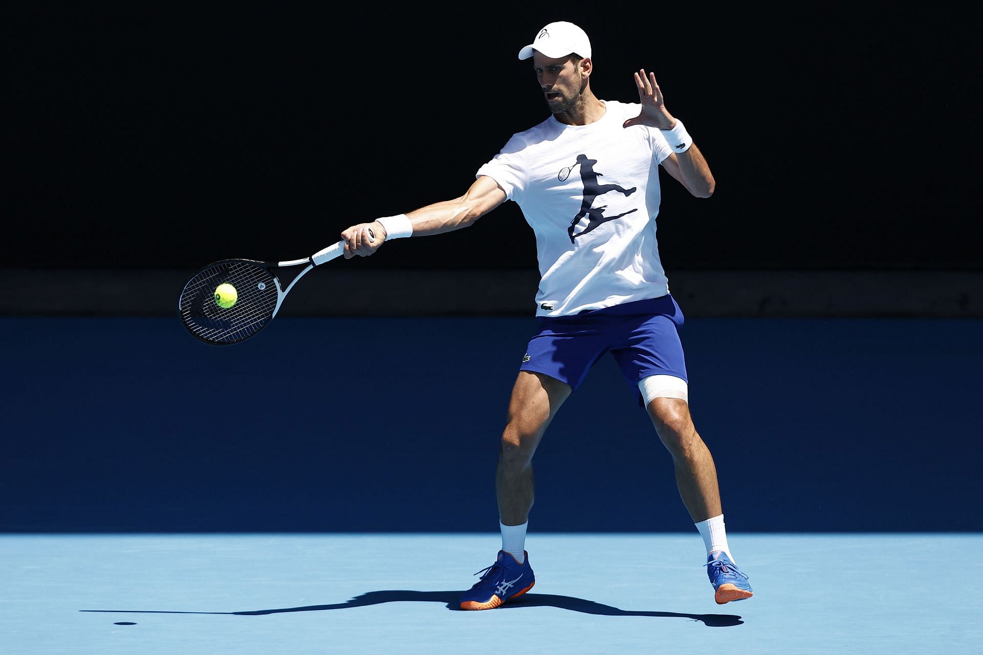Novak Djokovic plays a forehand shot during a practice session ahead of the 2023 Australian Open