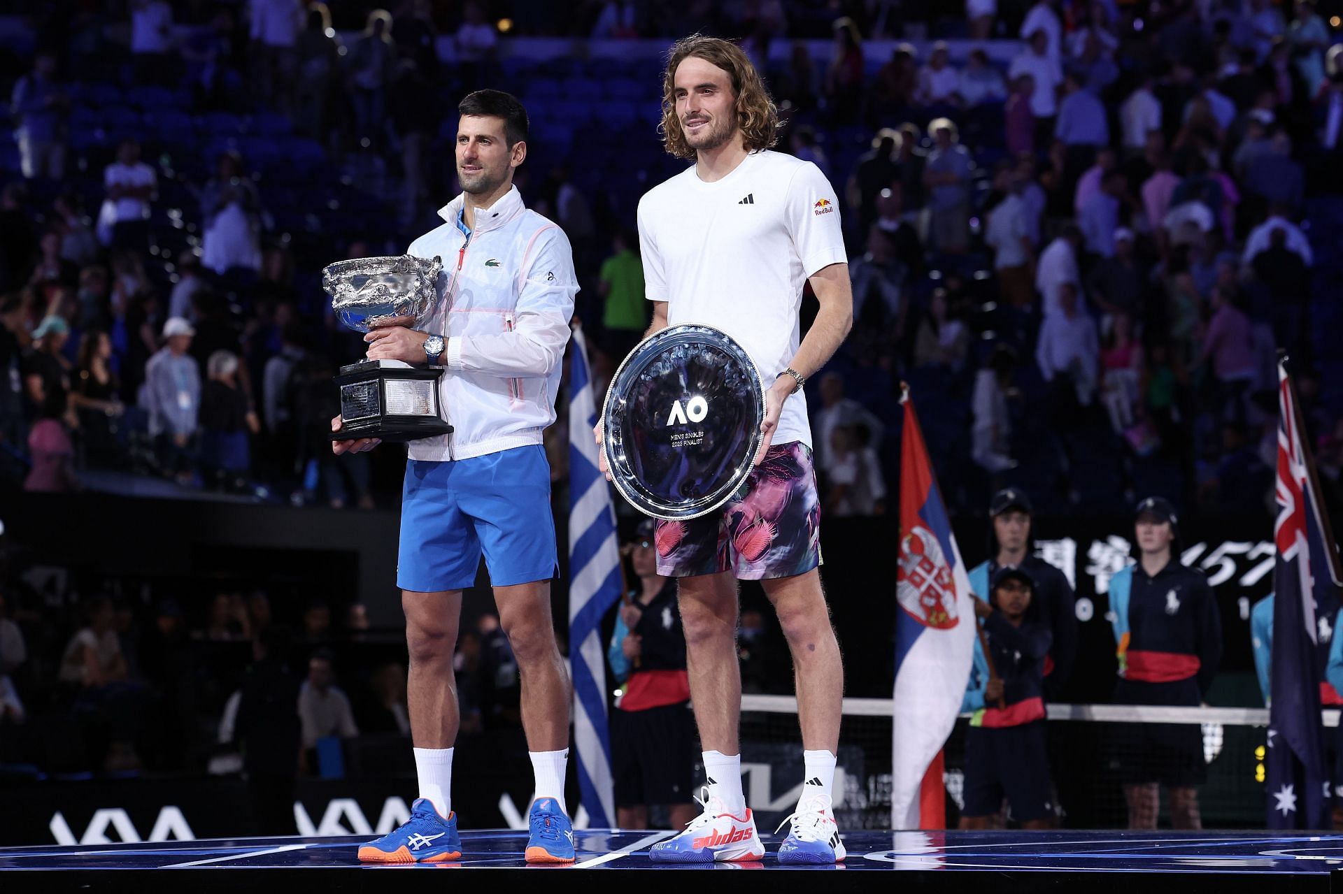Novak Djokovic and Stefanos Tsitsipas posing with their respective trophies