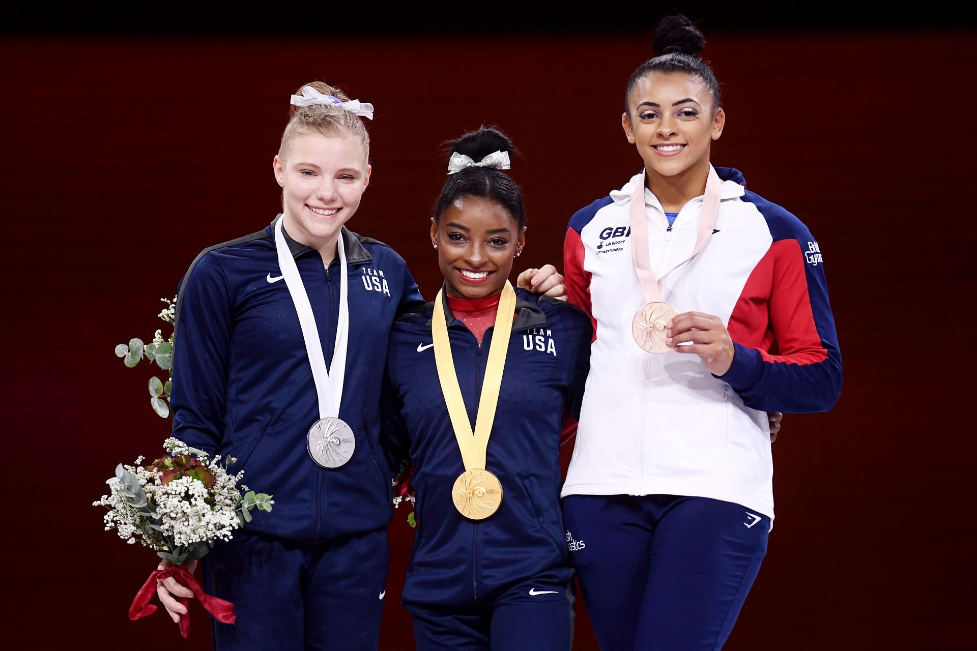 Simone Biles and Elissa Downie pose for a photo following Women&#039;s Vault Final at 49th FIG Artistic Gymnastics World Championships in 2019 