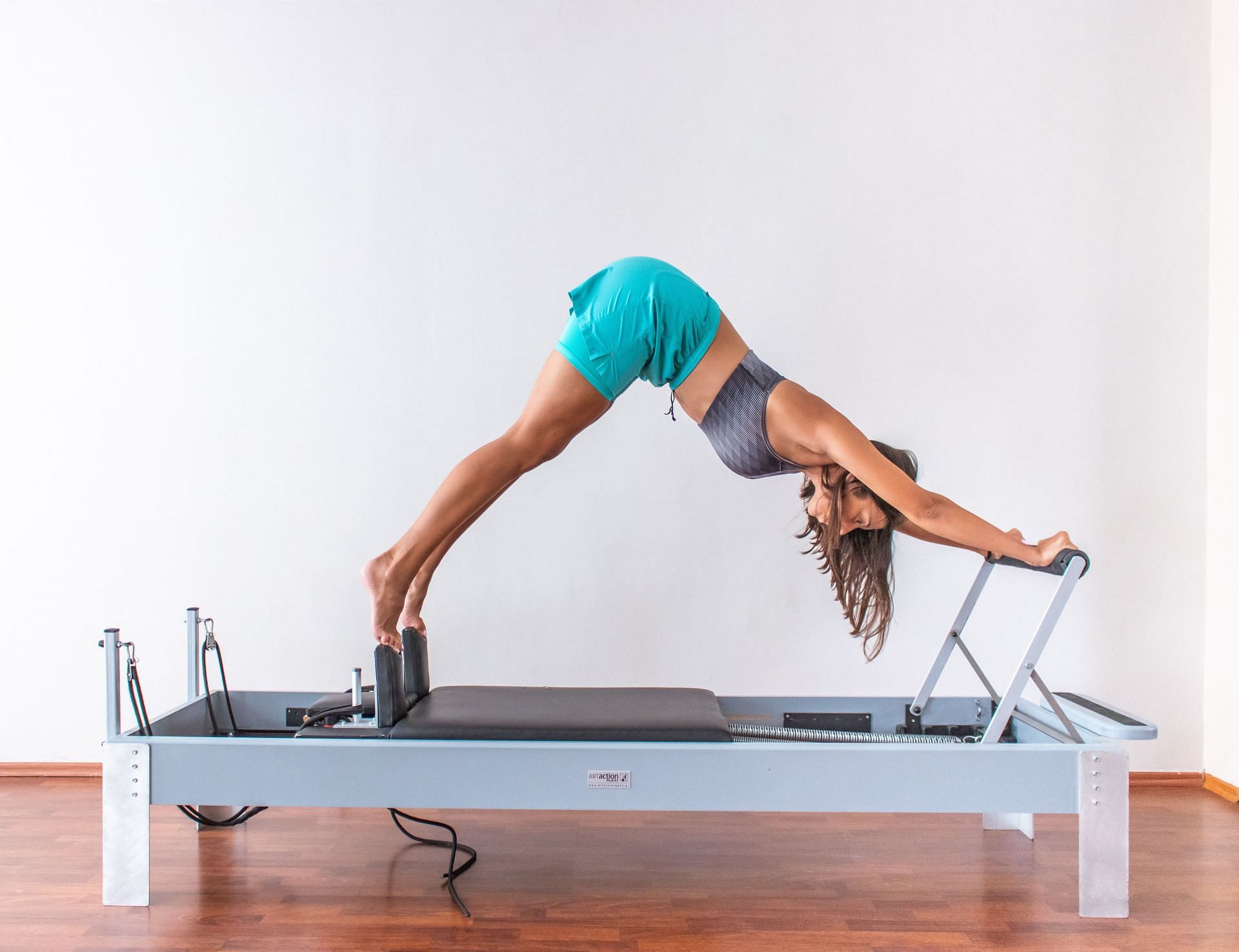 The Pilates reformer is an excellent exercise equipment to workout your core (Image via Pexels @Maria Charizani)