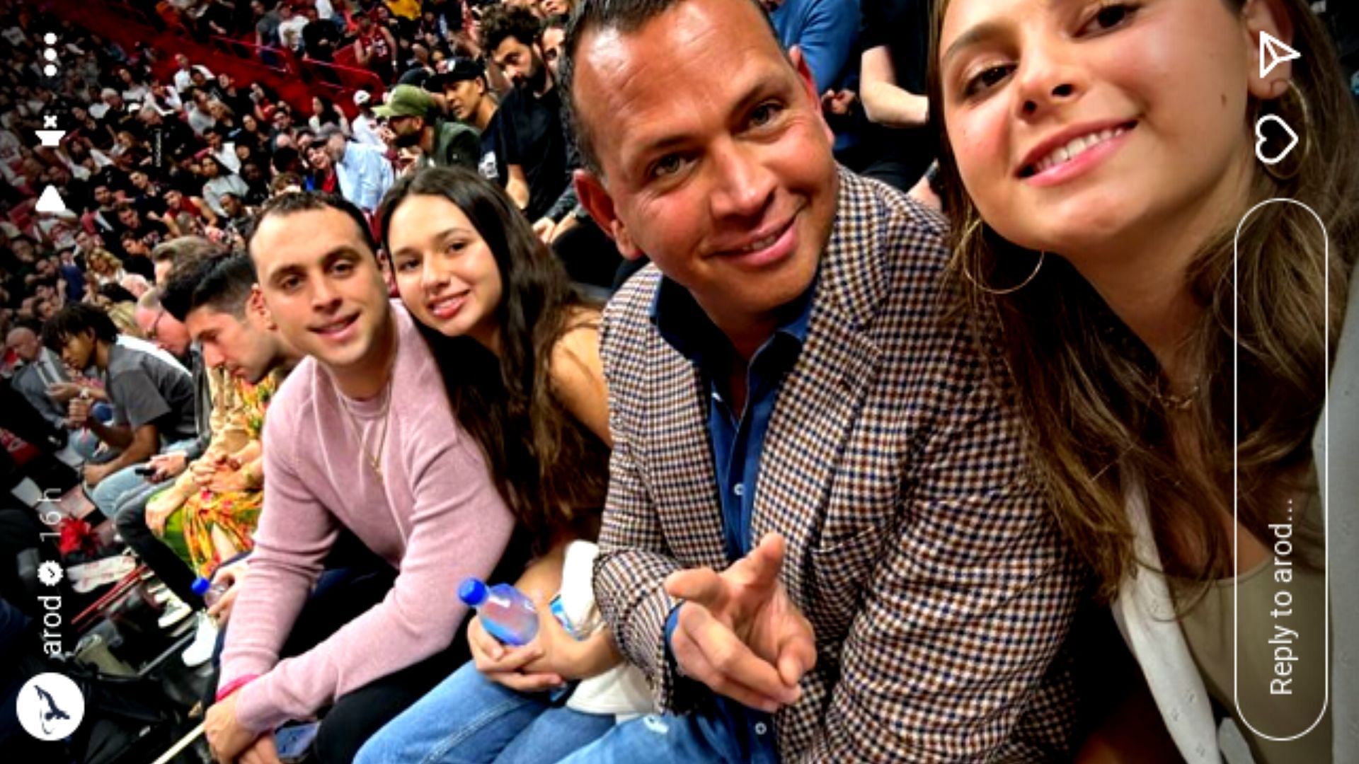 Alex Rodriguez with his two daughters and nephew at an NBA game.