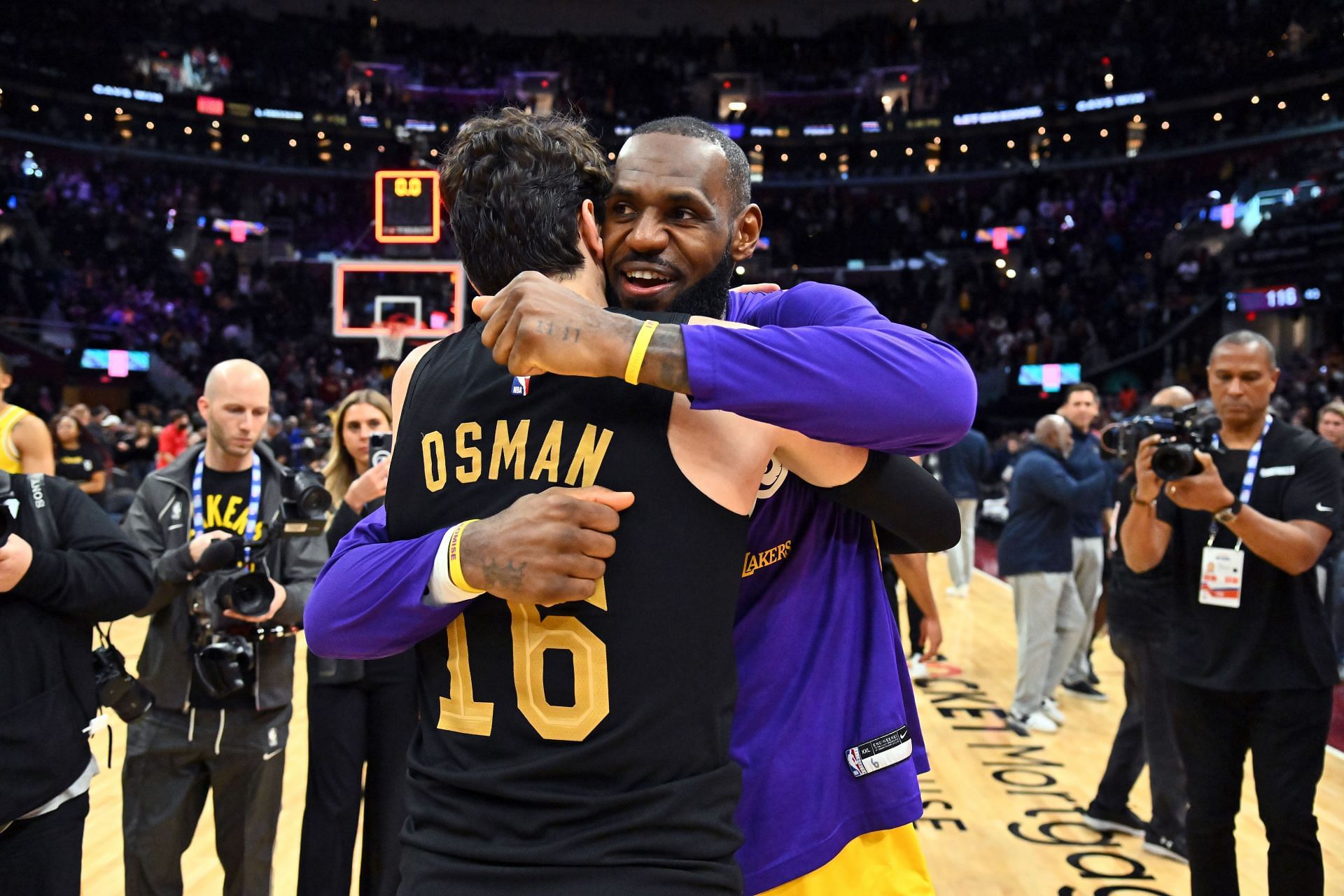 LeBron James hugging former Cavaliers teammate Cedi Osman.