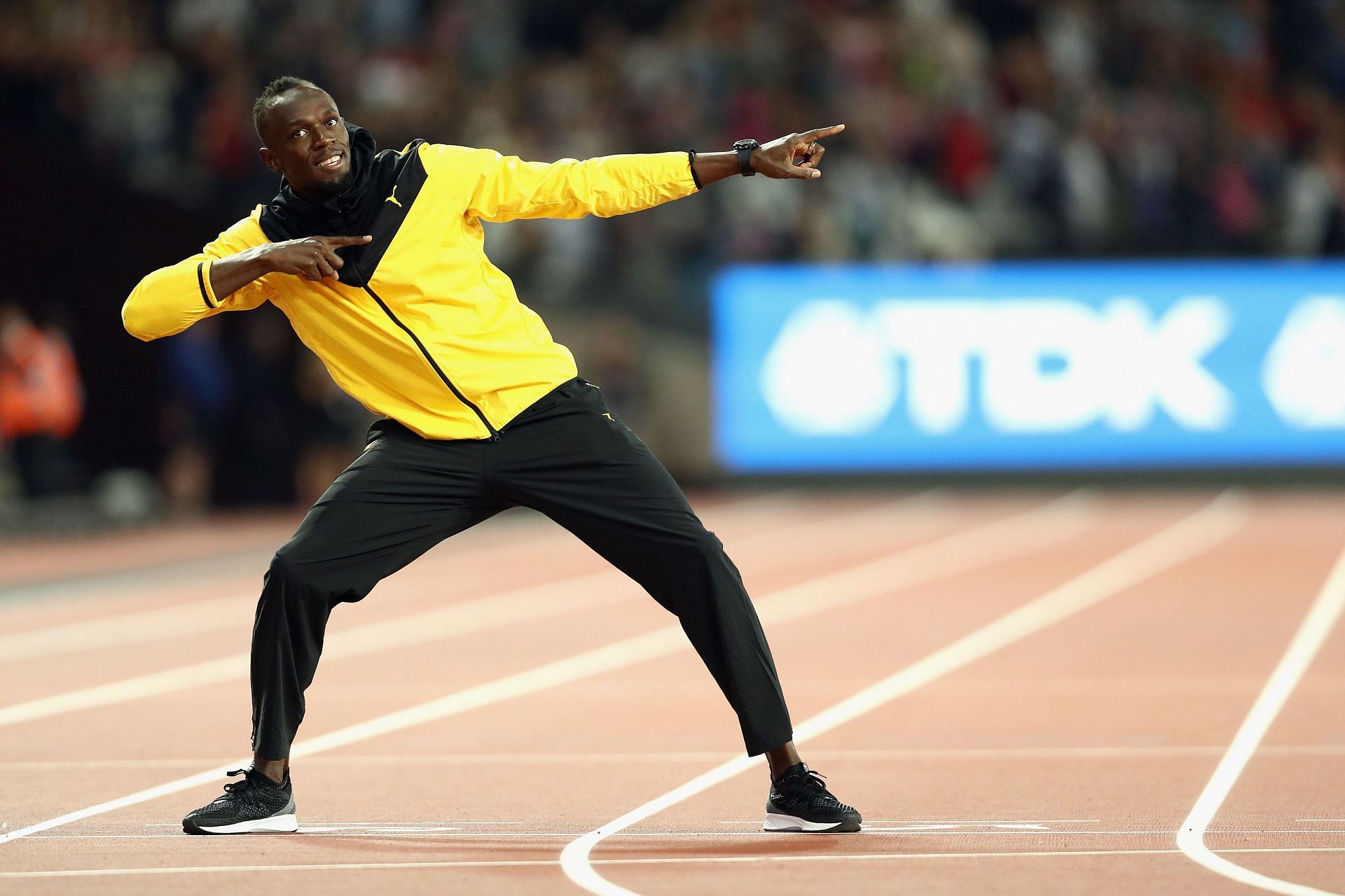 Usain Bolt of Jamaica bids farewell to fans after his last World Athletics Championships 