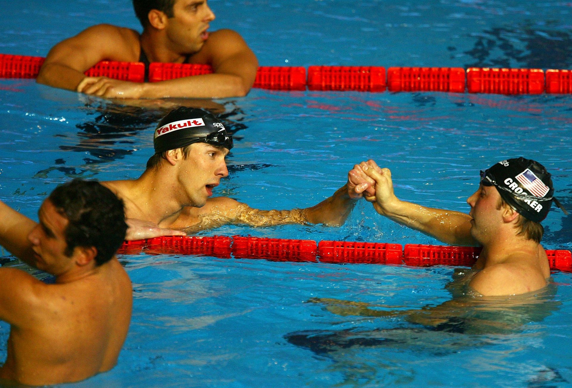 Ian Crocker of the United States of America congratulates Michael Phelps of the United States of America on winning the Men&#039;s 100m Butterfly Final during the XII FINA World Championships at the Rod Laver Arena on March 31, 2007, in Melbourne, Australia. (Photo by Al Bello/Getty Images)