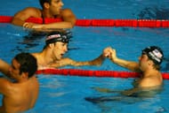 Ian Crocker of the United States of America congratulates Michael Phelps of the United States of America on winning the Men's 100m Butterfly Final during the XII FINA World Championships at the Rod Laver Arena on March 31, 2007, in Melbourne, Australia. (Photo by Al Bello/Getty Images)