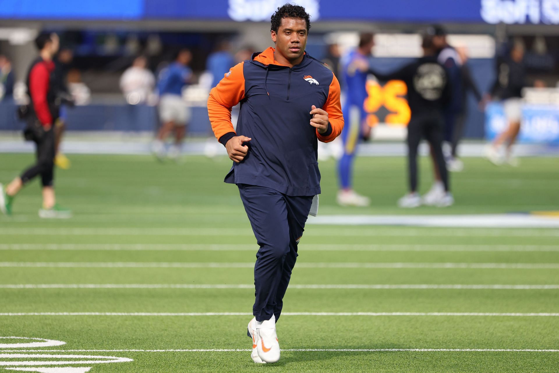 High Knees' Russell Wilson of Broncos Trolled by Seattle Seahawks Mascot  Blitz on Germany Trip - Sports Illustrated Seattle Seahawks News, Analysis  and More