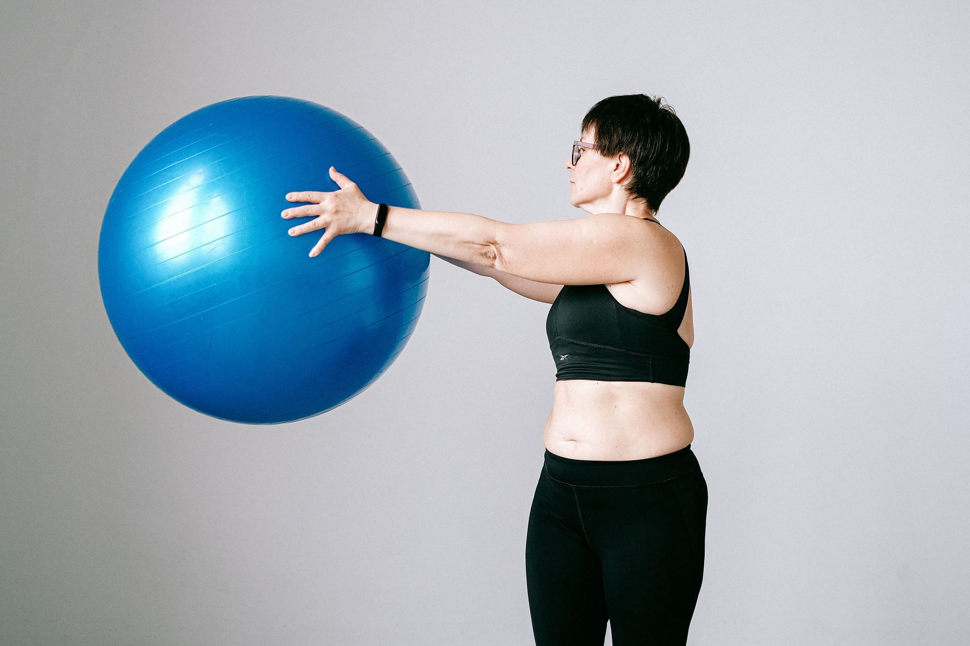 Exercise balls are an excellent equipment to work out with (Image via Pexels @Anna Shvets)
