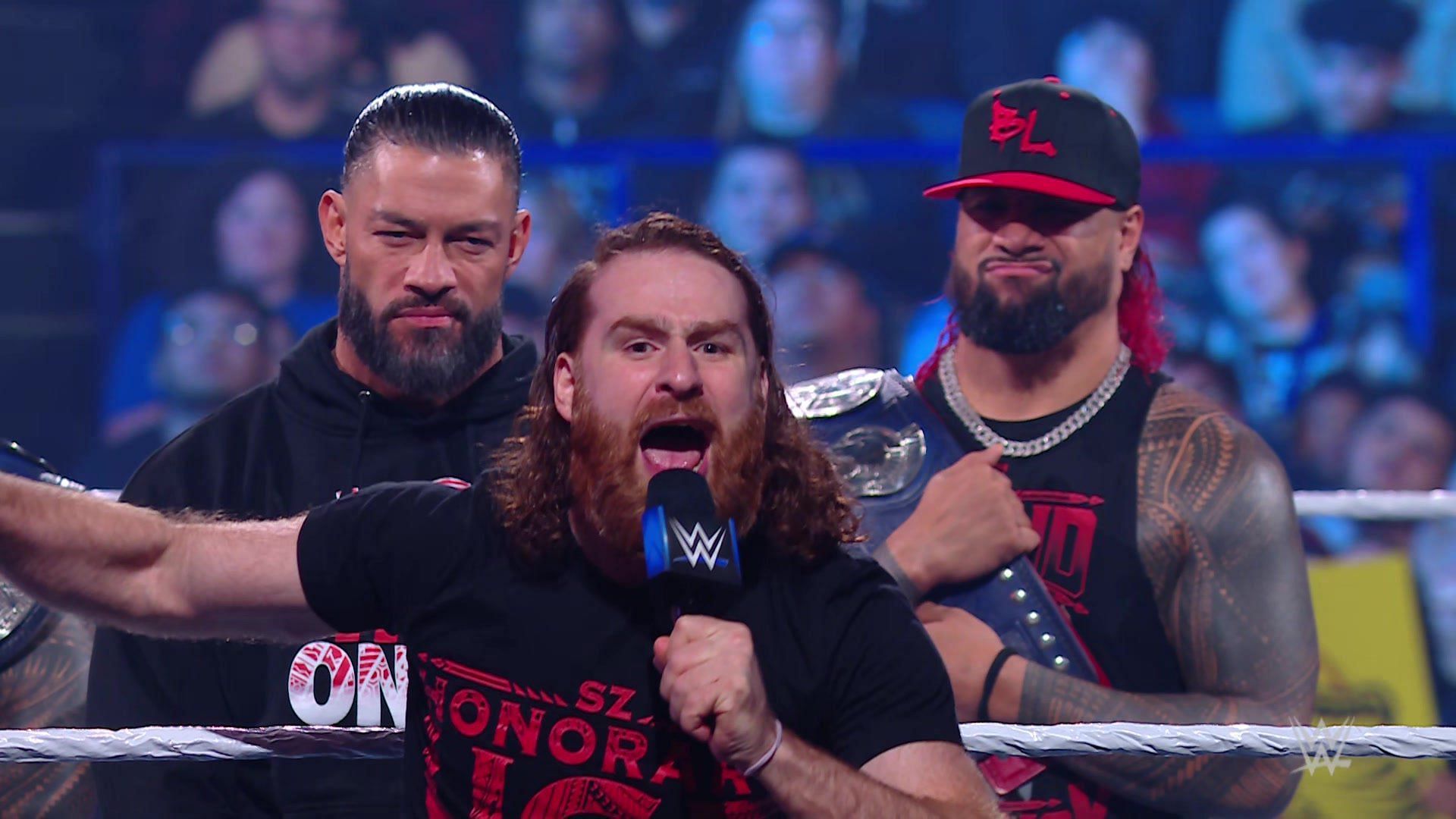 Sami Zayn, Roman Reigns, and Jimmy Uso