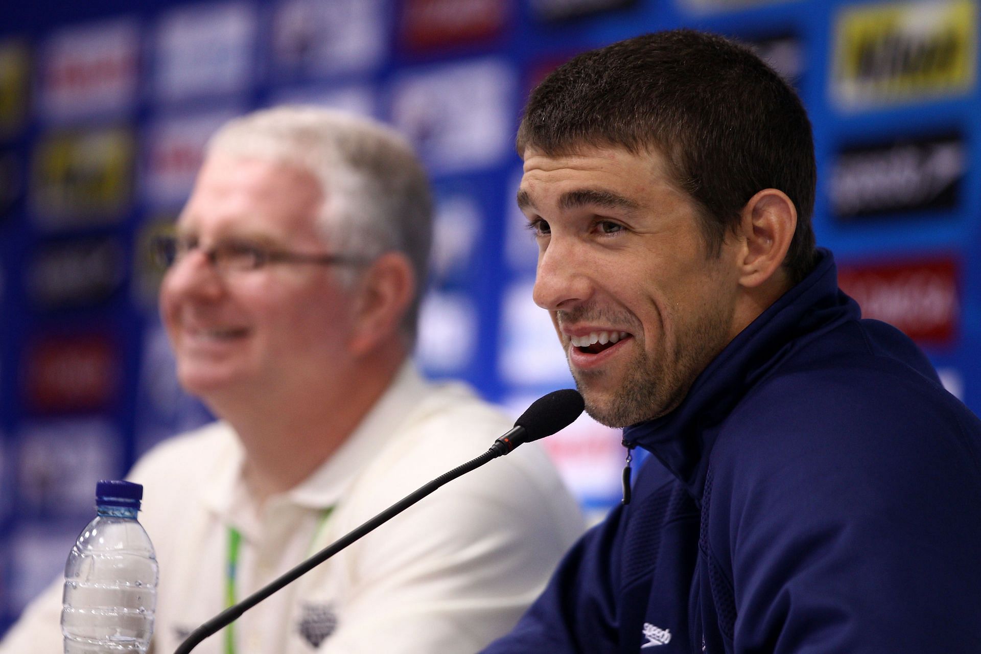 Michael Phelps of the United States and his coach Bob Bowman participate in a press conference on July 23, 2011 in Shanghai, China. (Photo by Feng Li/Getty Images)