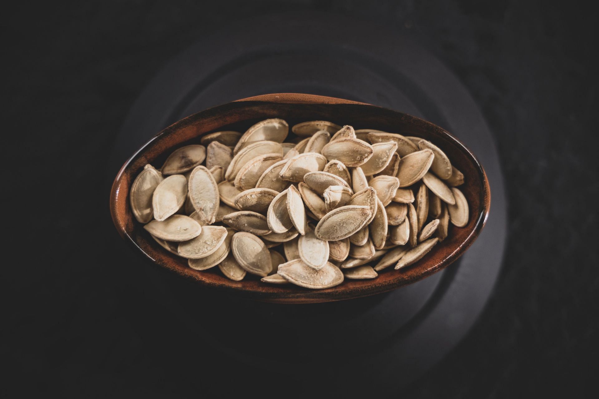 Raw pumpkin seeds are a great source of health-promoting minerals. (Image via Unsplash/Engin Akyurt)