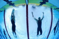 Michael Phelps of the United States (L) finishes just in front of Milorad Cavic of Serbia to win the gold medal and break a new world record in a time of 49.82 in the Men's 100m Butterfly Final during the 13th FINA World Championships at the Stadio del Nuoto on August 1, 2009 in Rome, Italy. (Photo by Al Bello/Getty Images)
