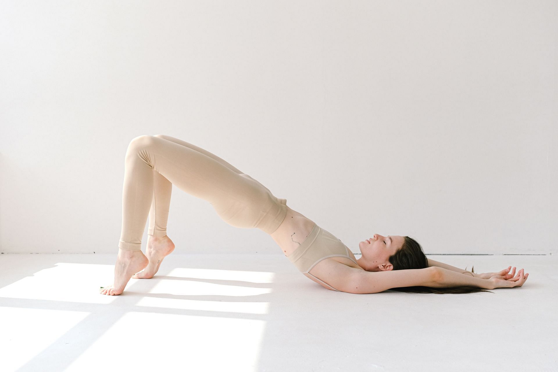 To perform this stretch, lie on your back. (Photo via Pexels/Anna Shvets)